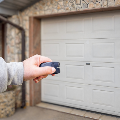 Lincoln security key fob pointing to a garage door